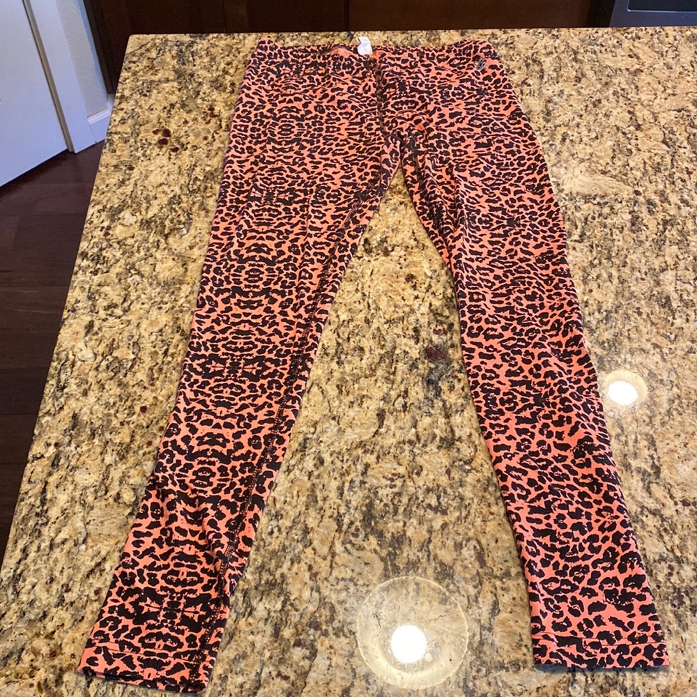 Orange/Black Cheetah Print leggings Size Medium. Super stretchy!
